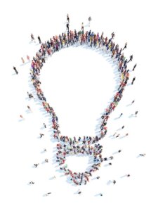 Group of people in the form of a lightbulb